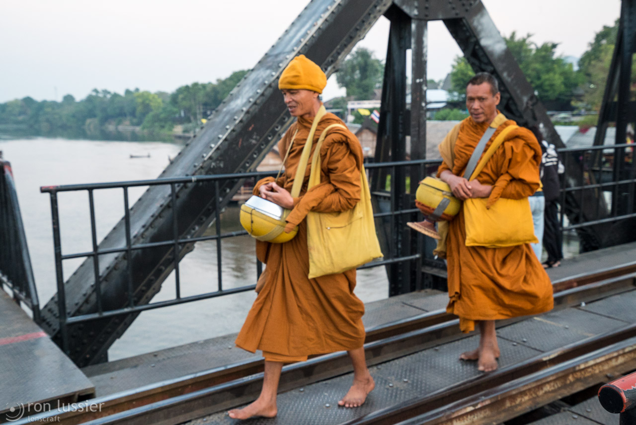 monks across the river kwai / kanchanaburi, thailand