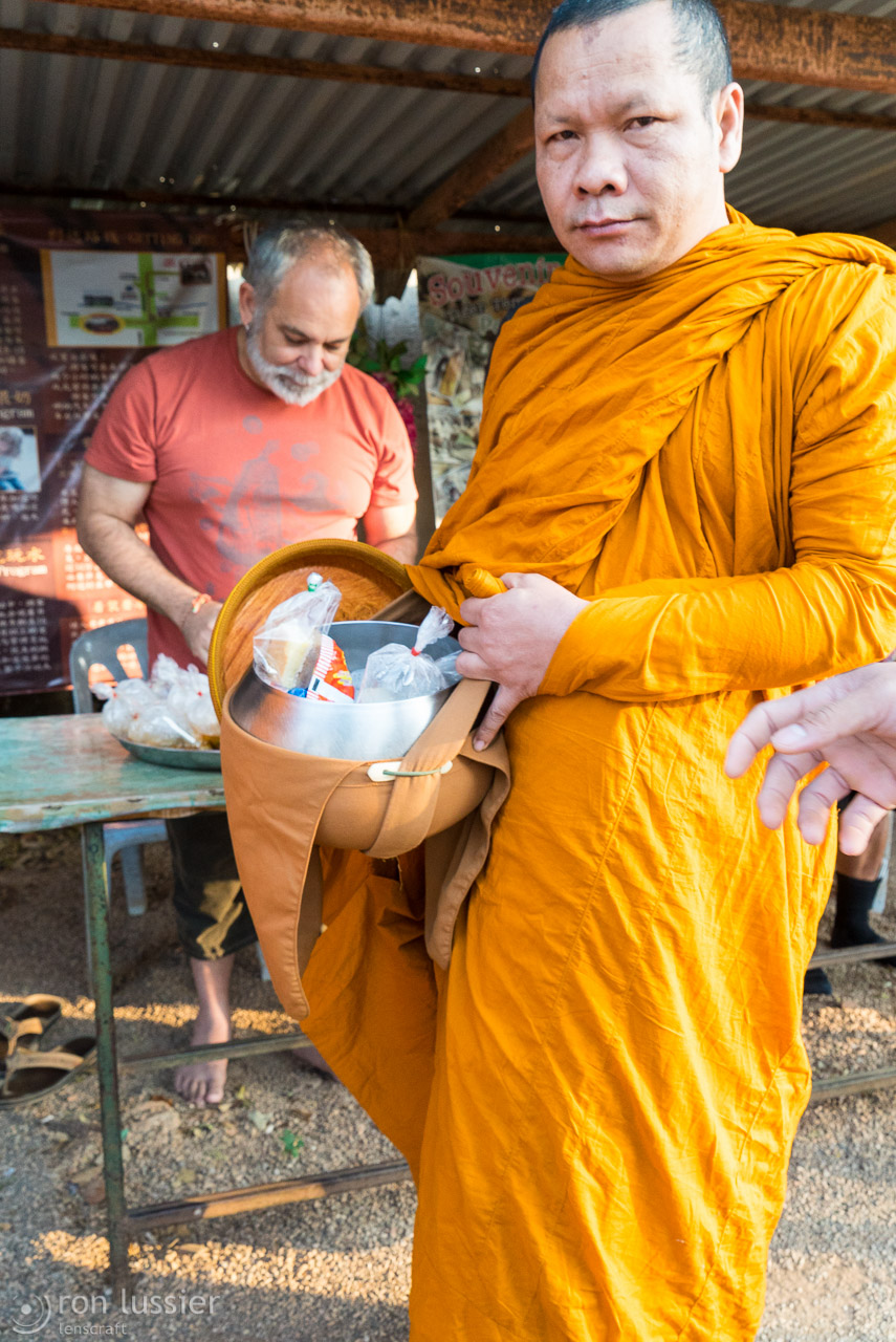 monk with food / wat pha luang ta bua, thailand